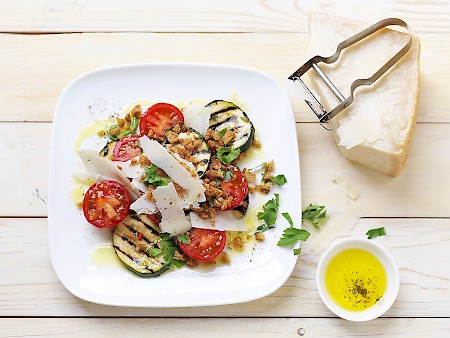 Cocktail tomatoes with grilled courgette, parmesan cheese, and toasted breadcrumbs